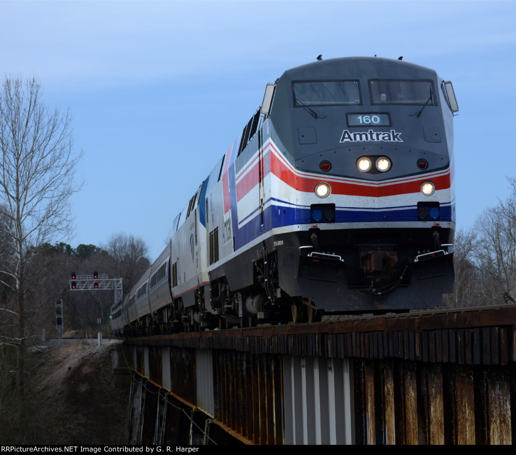 An on-time Amtrak Crescent, train #20, with Pepsi Can AMTK 160 leading crosses the Fishing Creek trestle